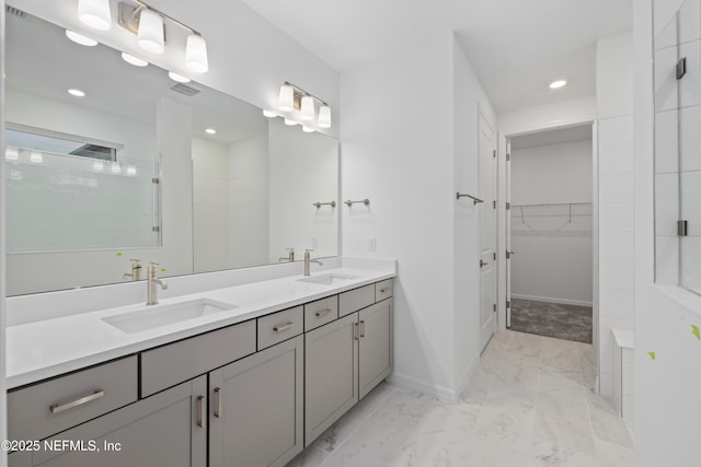 bathroom with vanity and walk in shower