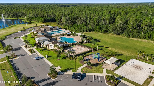 birds eye view of property with a water view