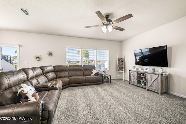 carpeted living room featuring ceiling fan