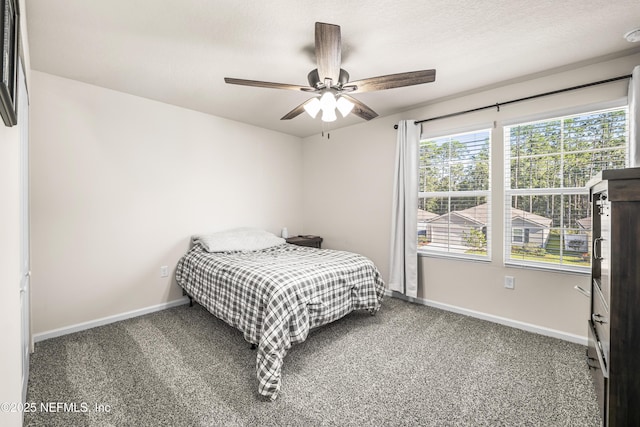 bedroom with ceiling fan and carpet