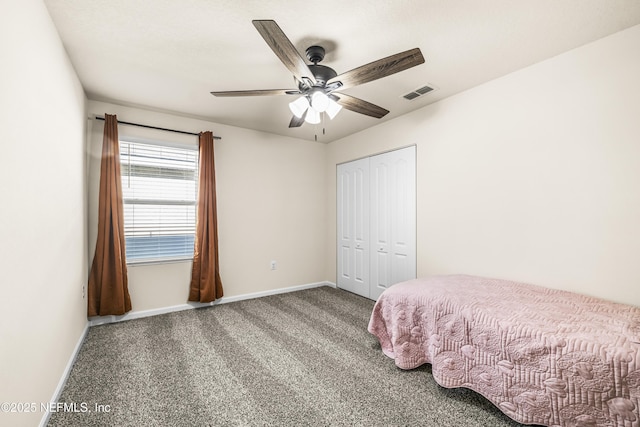 unfurnished bedroom featuring ceiling fan, a closet, and carpet floors