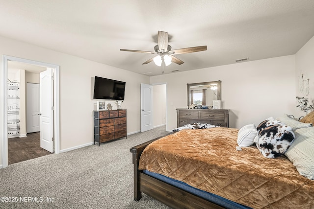 bedroom featuring ceiling fan and carpet