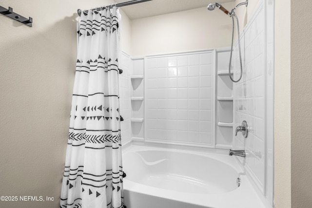 bathroom with shower / bath combo with shower curtain