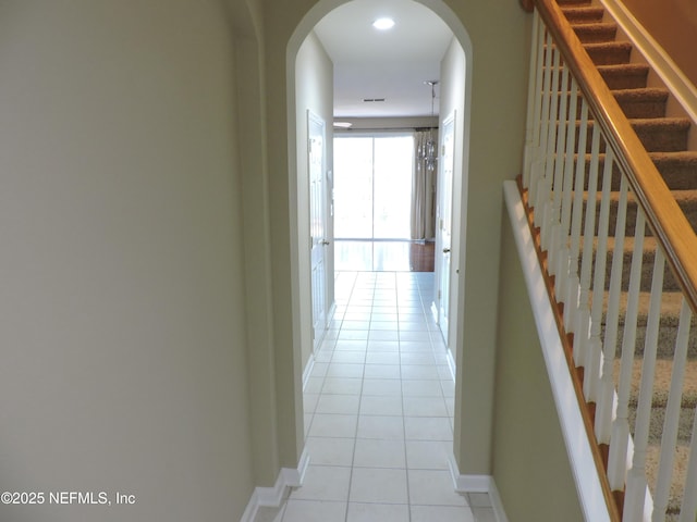 corridor with light tile patterned floors