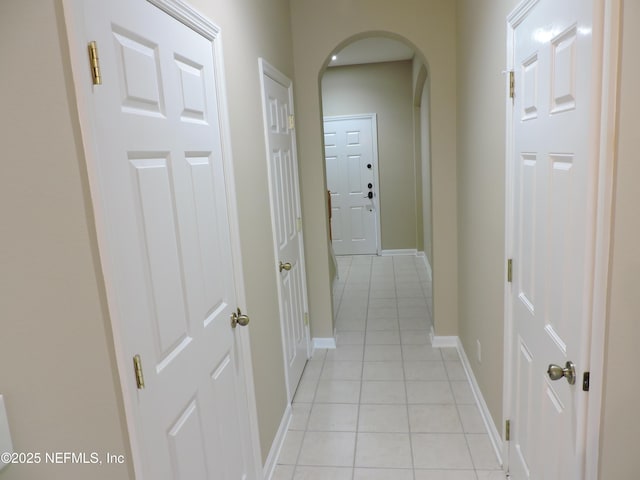 hallway with light tile patterned flooring