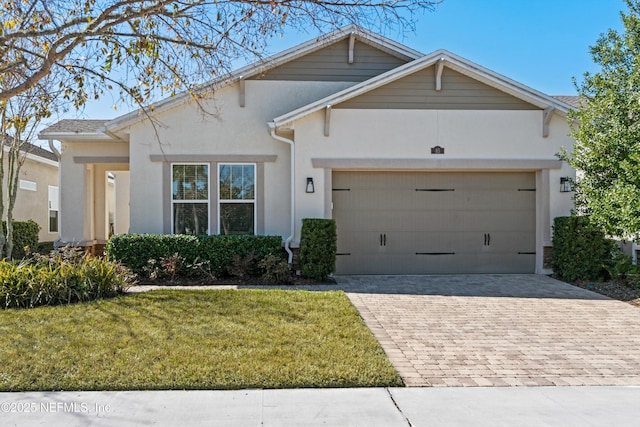 view of front facade with a front lawn and a garage