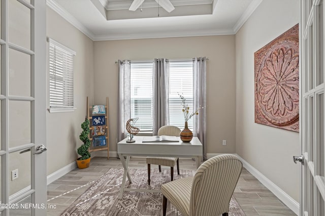 office area featuring a tray ceiling, crown molding, and ceiling fan