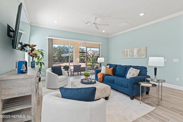 living room featuring hardwood / wood-style floors, crown molding, and ceiling fan