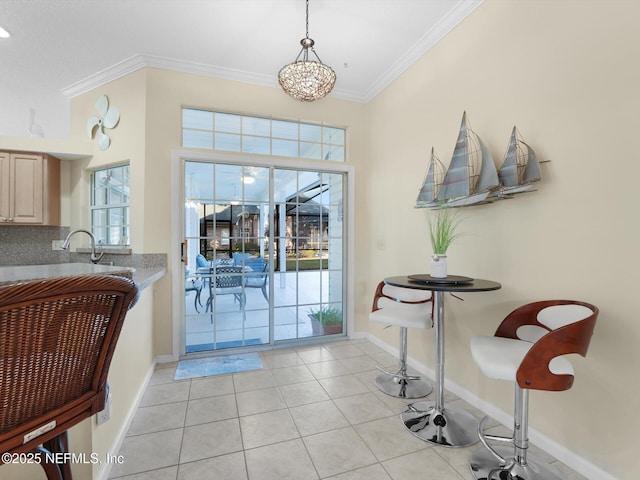 foyer featuring crown molding and light tile patterned flooring