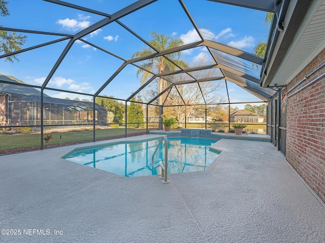 view of swimming pool featuring a lanai and a patio area