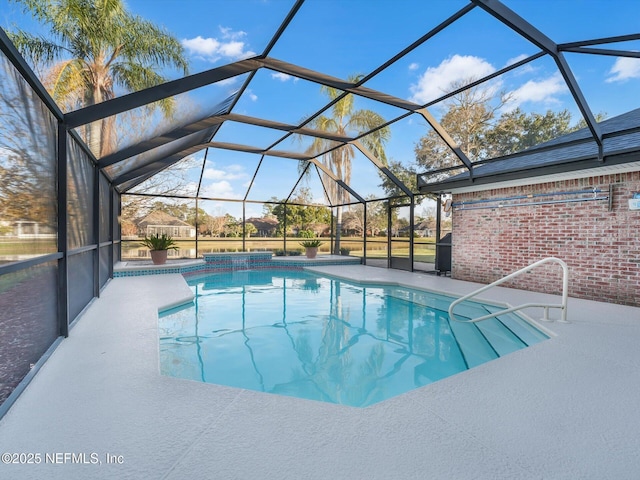 view of swimming pool featuring a lanai and a patio