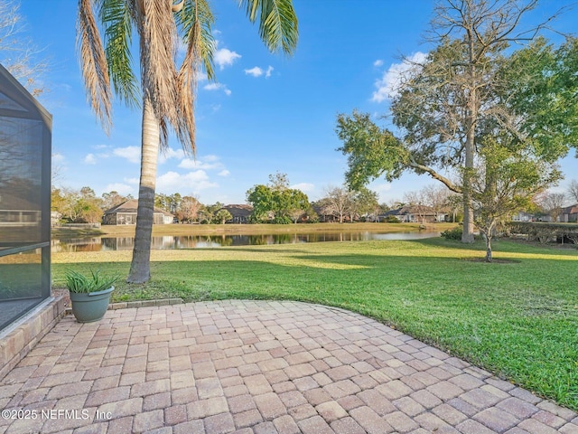 view of patio with a water view