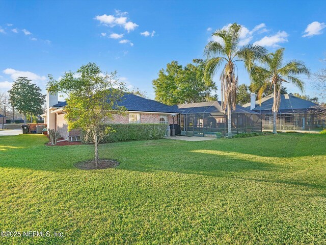 view of yard with a lanai