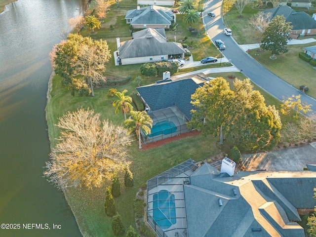 birds eye view of property with a water view