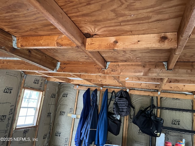 interior space featuring wooden ceiling and beamed ceiling