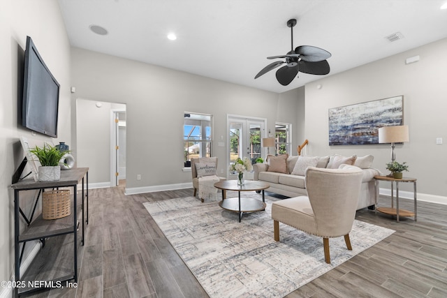 living room featuring hardwood / wood-style flooring and ceiling fan