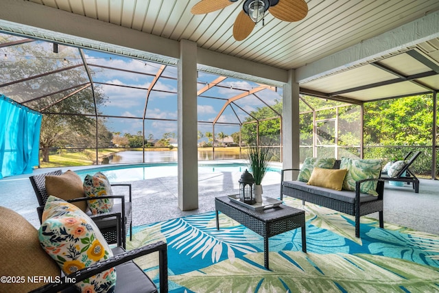 sunroom / solarium featuring ceiling fan