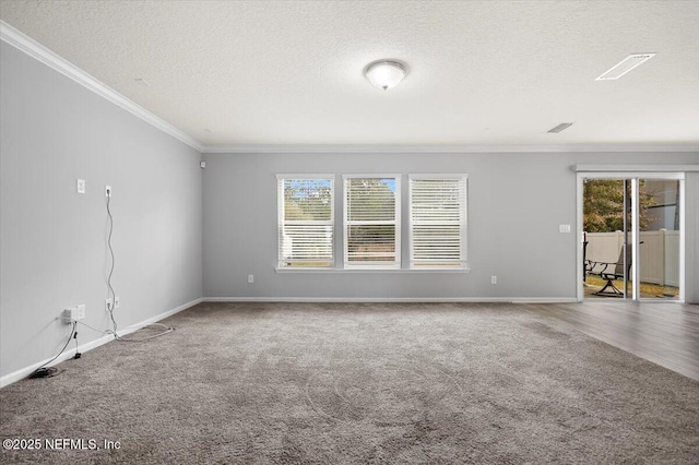 carpeted empty room featuring a textured ceiling and crown molding