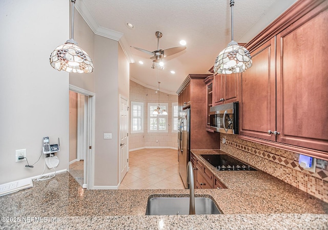 kitchen with sink, crown molding, light tile patterned floors, ceiling fan, and stainless steel appliances