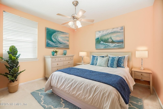 bedroom featuring light carpet and ceiling fan