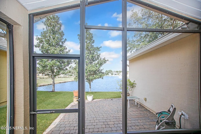 doorway with a water view and plenty of natural light