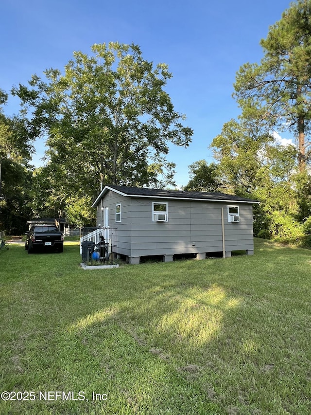 view of home's exterior with a lawn