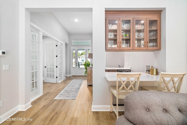 foyer with french doors and light wood-type flooring