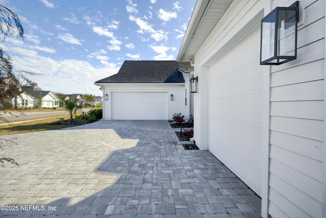 view of side of home featuring a garage