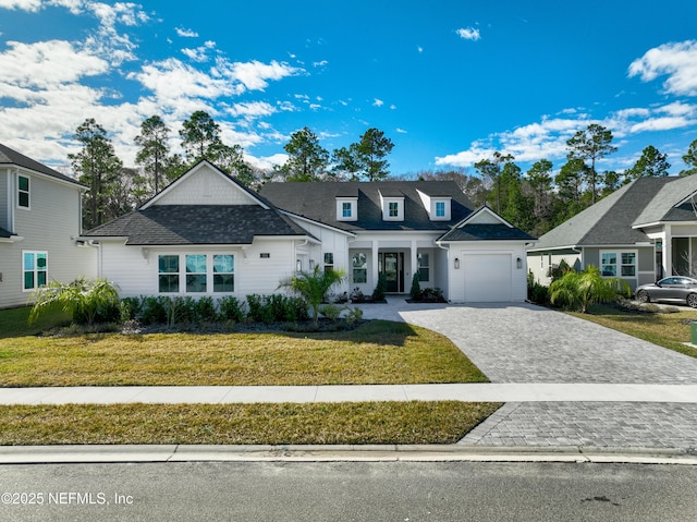 view of front facade featuring a garage and a front lawn