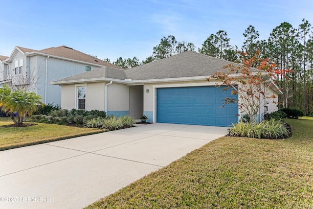 view of front of house with a garage and a front yard