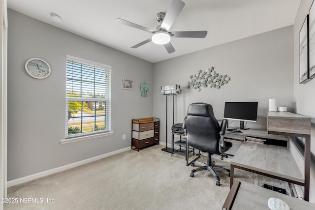 carpeted office with ceiling fan