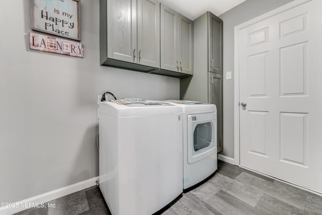 laundry room with cabinets and washer and dryer