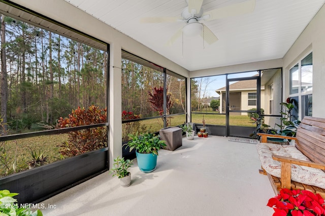 sunroom / solarium featuring ceiling fan