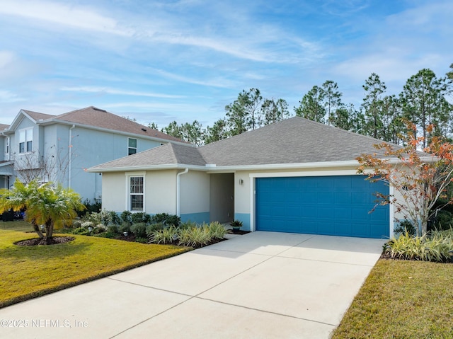 view of front of home with a garage and a front yard