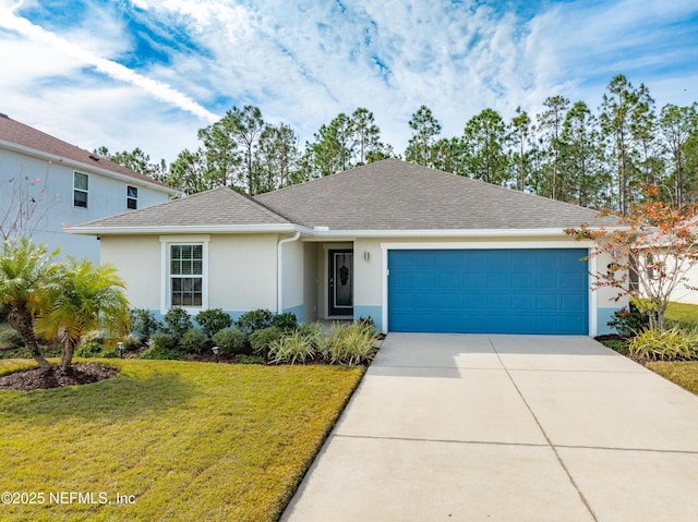 view of front of house with a garage and a front lawn