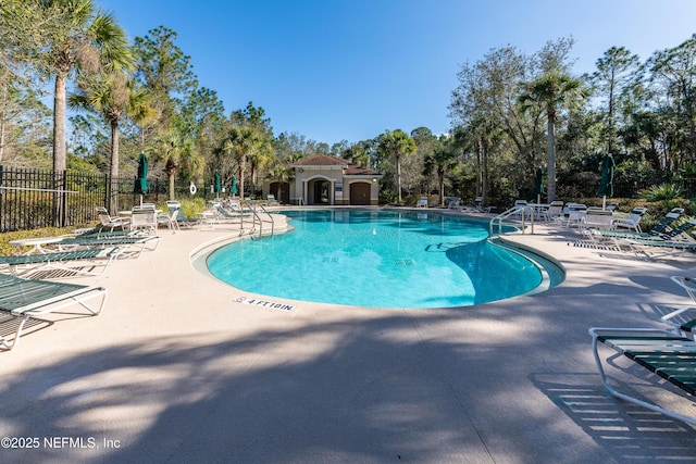 view of swimming pool with a patio area