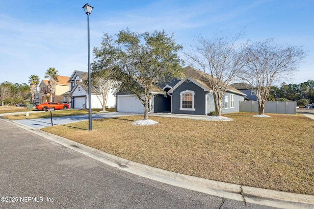 single story home featuring a garage and a front lawn