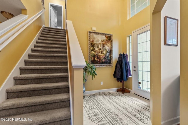 staircase featuring tile patterned floors