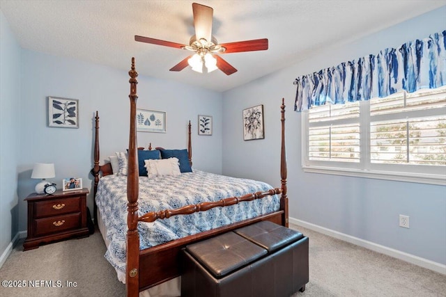bedroom featuring light colored carpet and ceiling fan