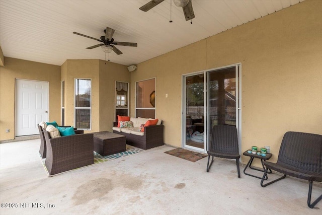 view of patio with ceiling fan and an outdoor living space