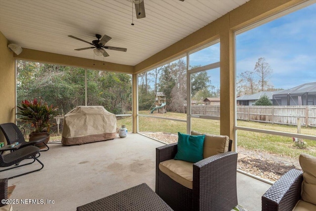 sunroom with ceiling fan and a healthy amount of sunlight