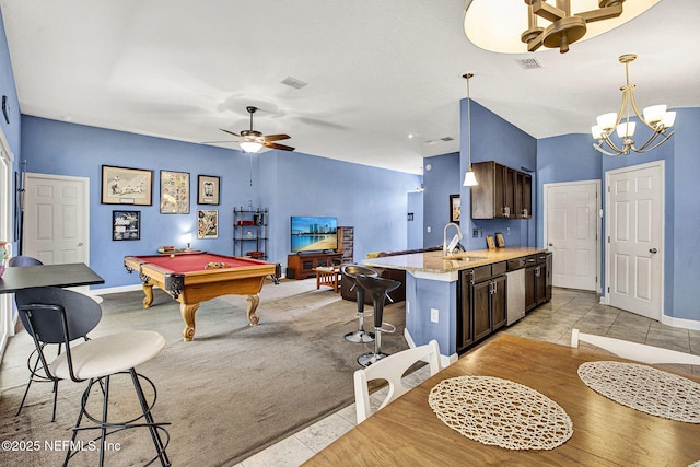 recreation room with a ceiling fan, visible vents, a sink, and baseboards