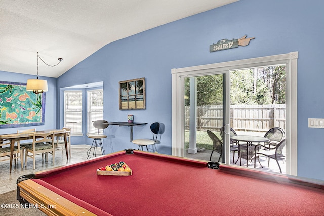 playroom featuring a textured ceiling, billiards, baseboards, vaulted ceiling, and tile patterned floors