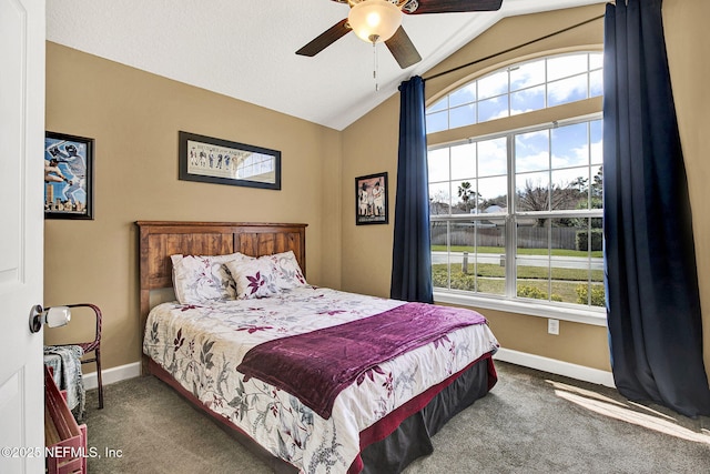 bedroom featuring vaulted ceiling, carpet flooring, a ceiling fan, and baseboards