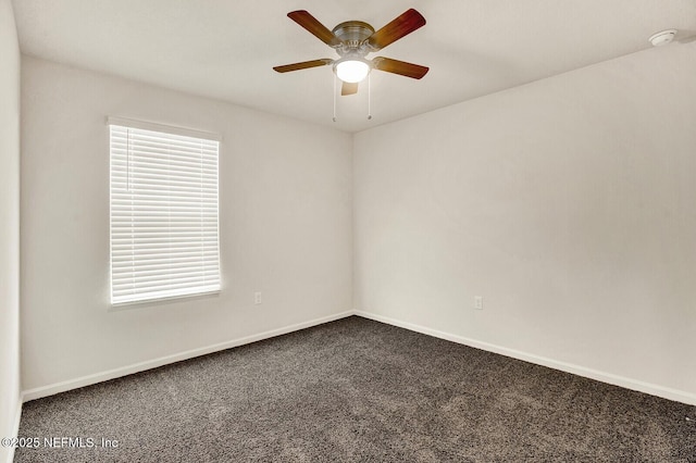 carpeted empty room featuring ceiling fan