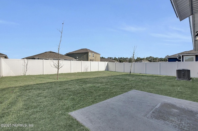 view of yard featuring central air condition unit