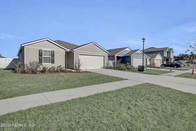 ranch-style home featuring a front yard and a garage