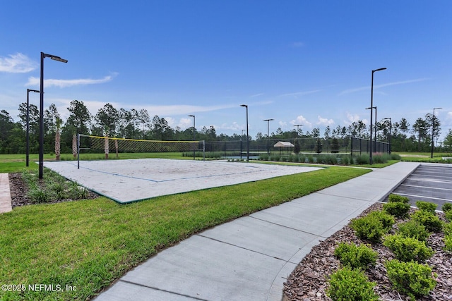 view of community featuring a yard and volleyball court