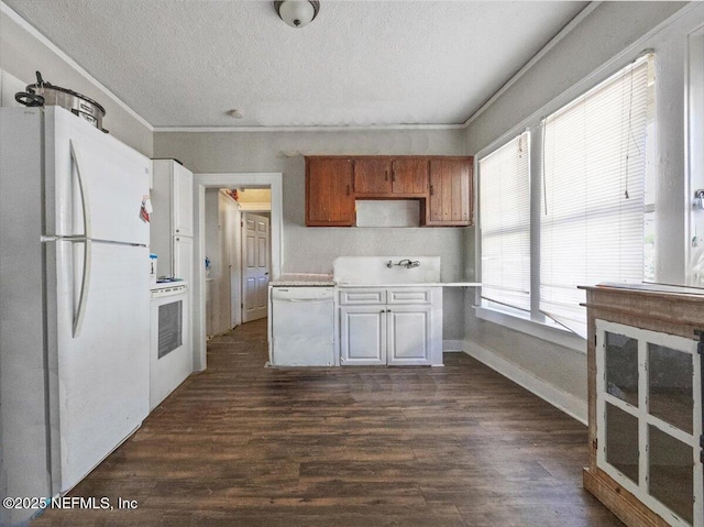 kitchen featuring crown molding, white appliances, dark hardwood / wood-style floors, and a textured ceiling