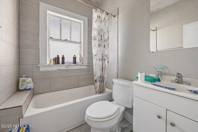 full bathroom with vanity, toilet, and shower / bath combo with shower curtain